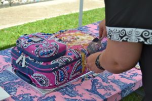 serving vera bradley boysenberry suitcase cake