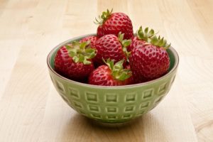 strawberries in green bowl