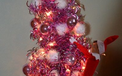 Elf on a Shelf Decorates the Christmas Tree