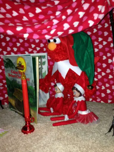 elmo with the elf on the shelf reading a story elmo with elf on shelf