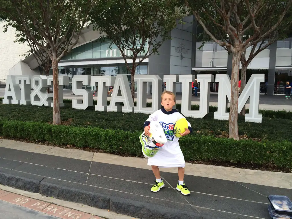 Boy in front of stadium