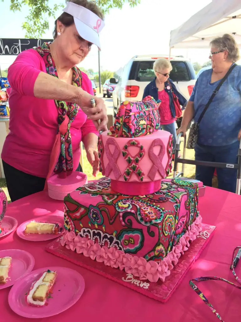 Slicing pink cake