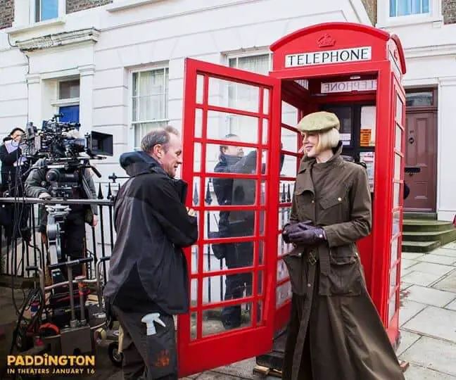 Woman in front of phone booth