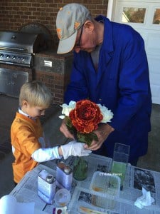 adding flowers to resin vase