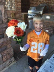 Boy with flowers in hand