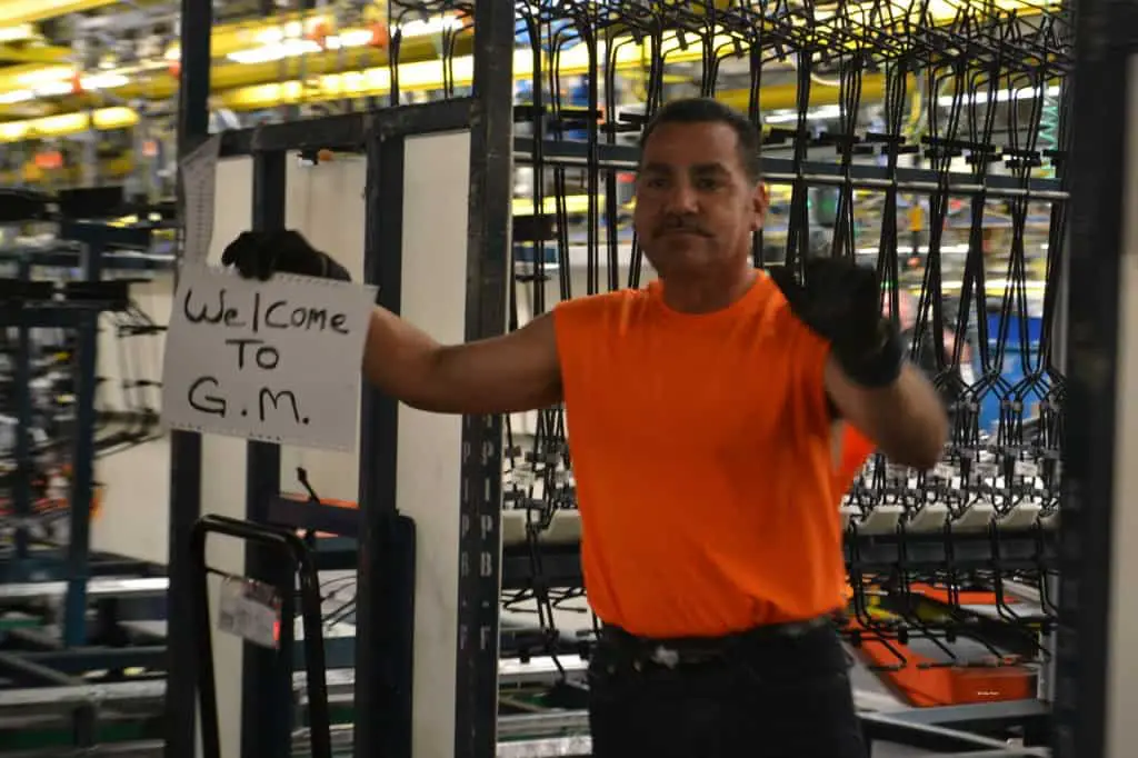 a worker welcomes us at GM Arlington