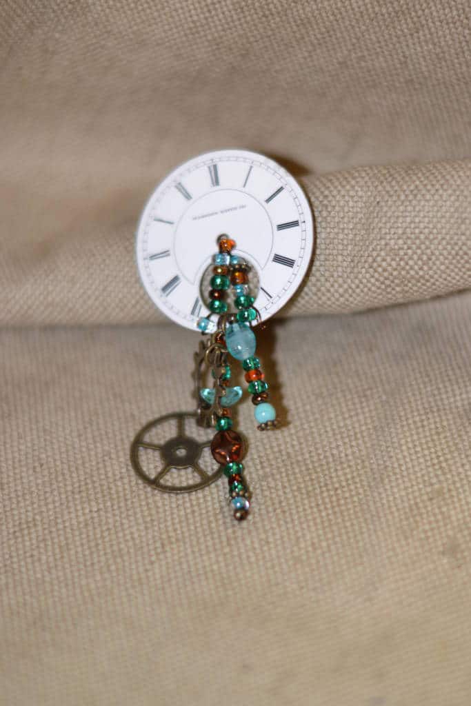 clock face brooches