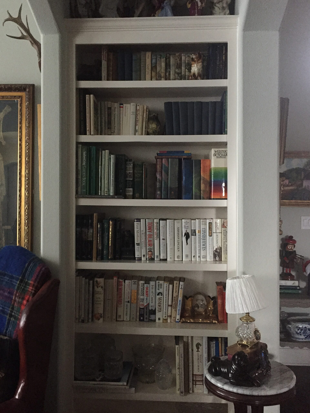 color organized bookcase rainbow bookshelf