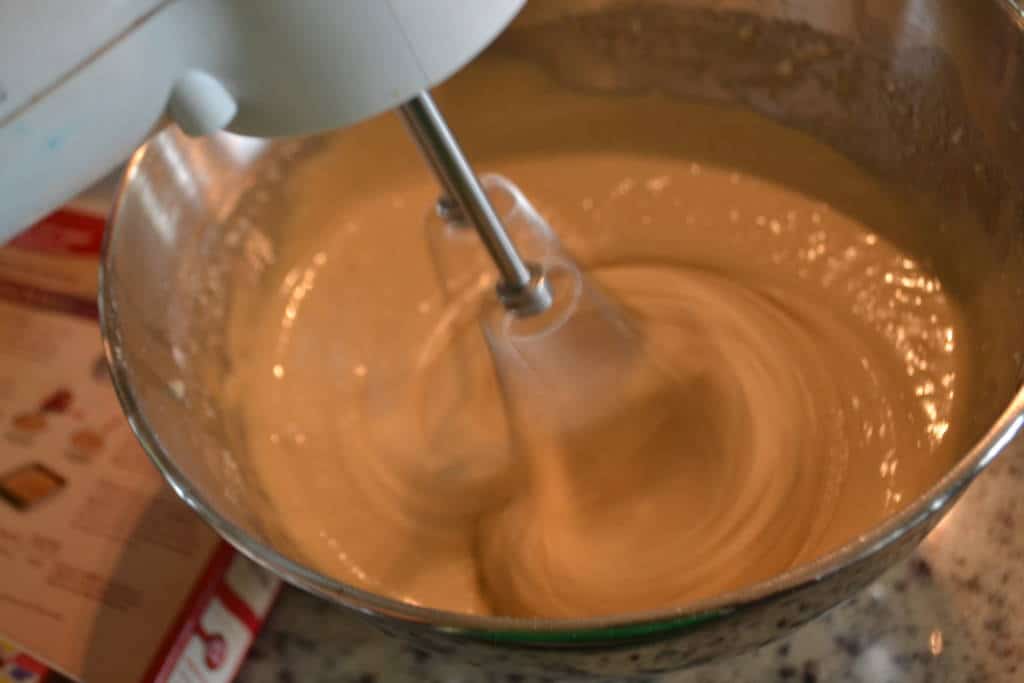 mixing caramel gelato and chocolate chips