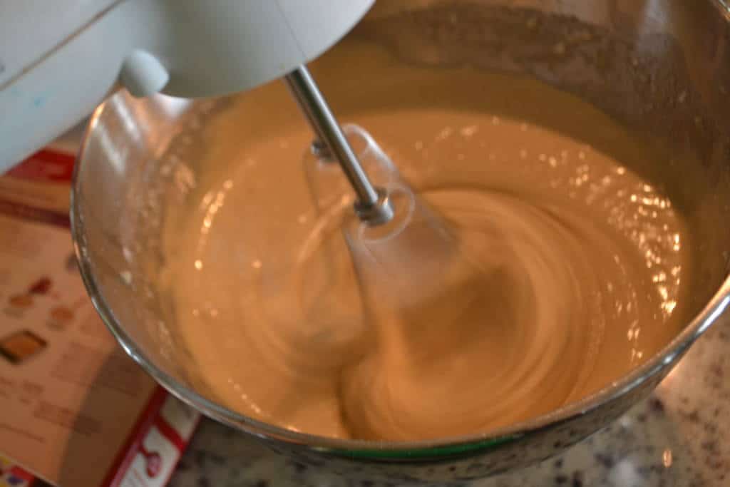 mixing caramel gelato and chocolate chips mixing caramel gelato and chocolate chips