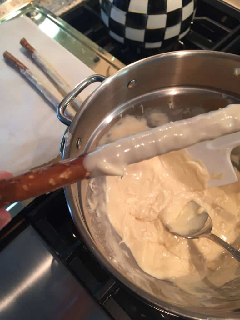 melted white chocolate on pretzel stick melted white chocolate on pretzel stick