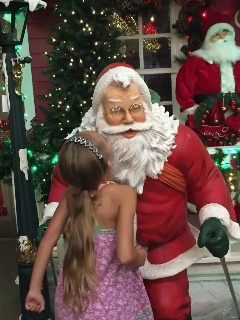 kissing santa at the decorators warehouse