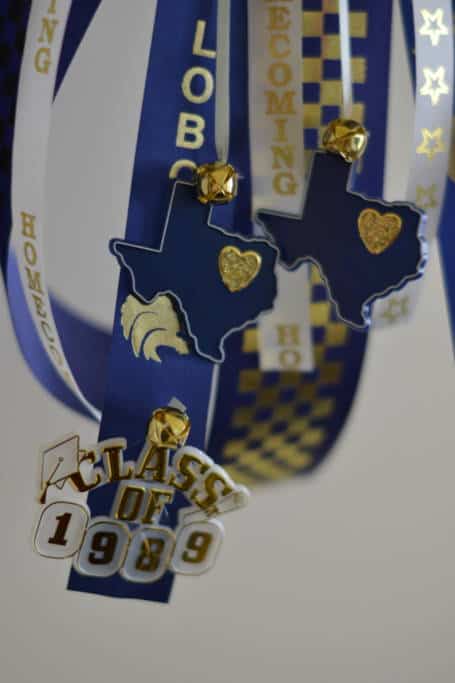 adding accents on homecoming mum layering ribbons for homecoming mum