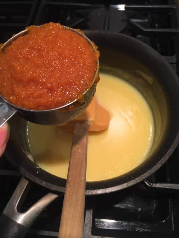 mixing pudding and pumpkin pie filling