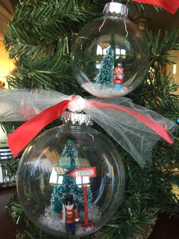 snow globe ornaments in tree