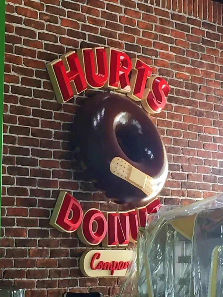 hurts donuts sign