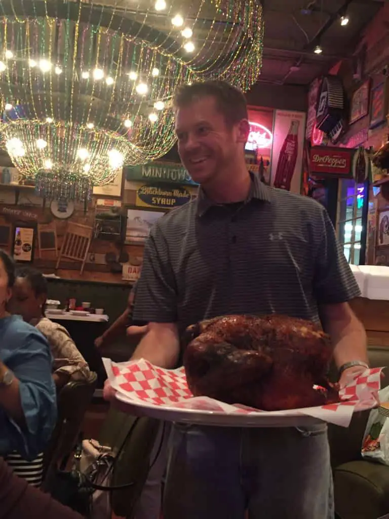 waiter serving roasted turkey - Razzoo's Cajun Cafe