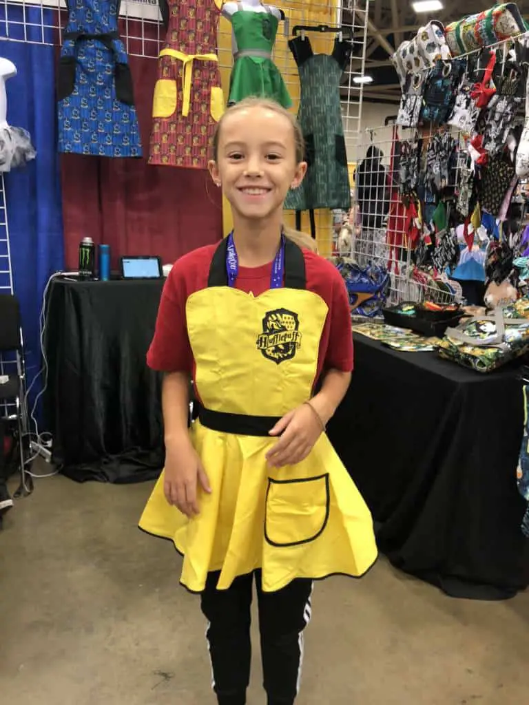 Hufflepuff apron from Leaky Con girl with apron at leaky con