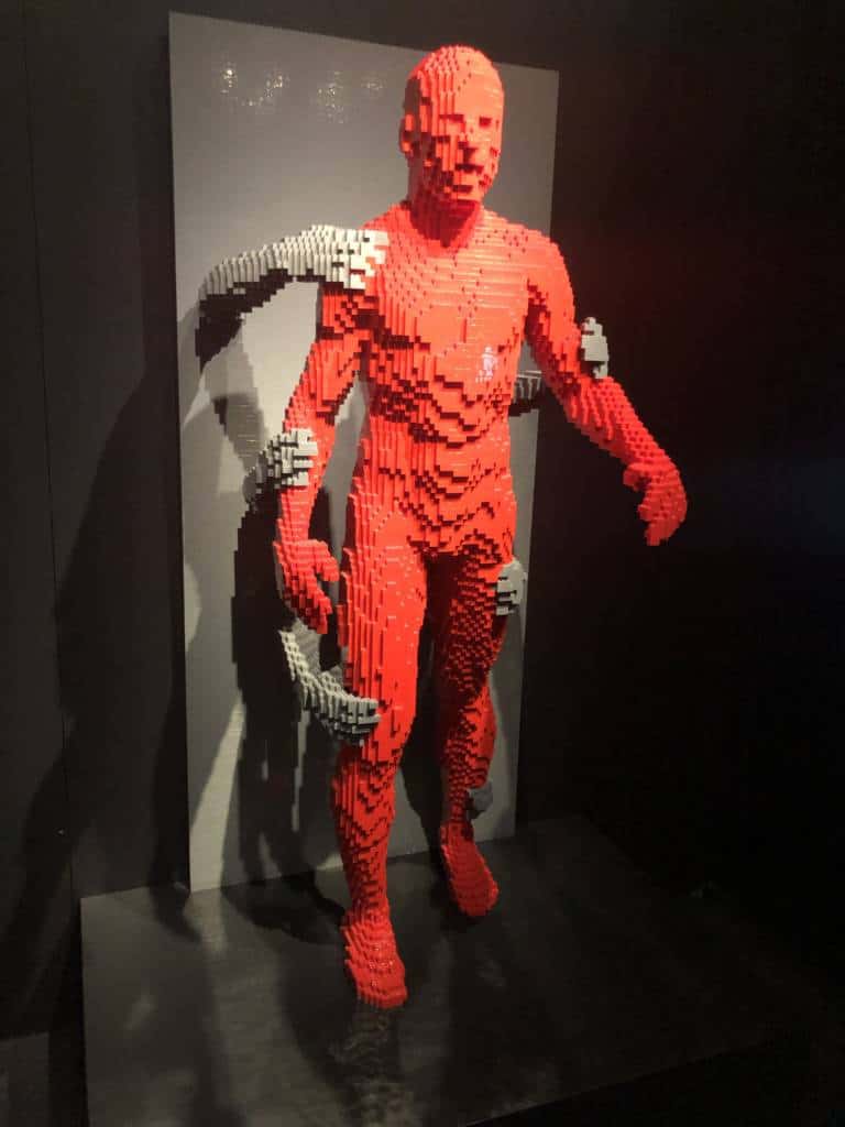 LEGO red man holding back