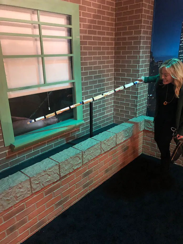 poke-guy poking the ugly guy through the window on Friends Experience set